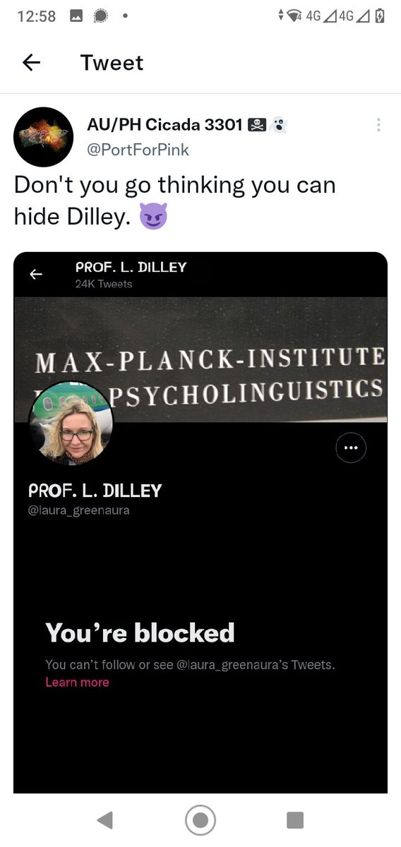 Tuit de AU/PH Cicada 3301, cuenta PortForPink: Don't you go thinking you can hide Dilley, con un emoji de diablo, sobre una captura del perfil de Twitter de la Prof. L. Dilley que dice You're blocked