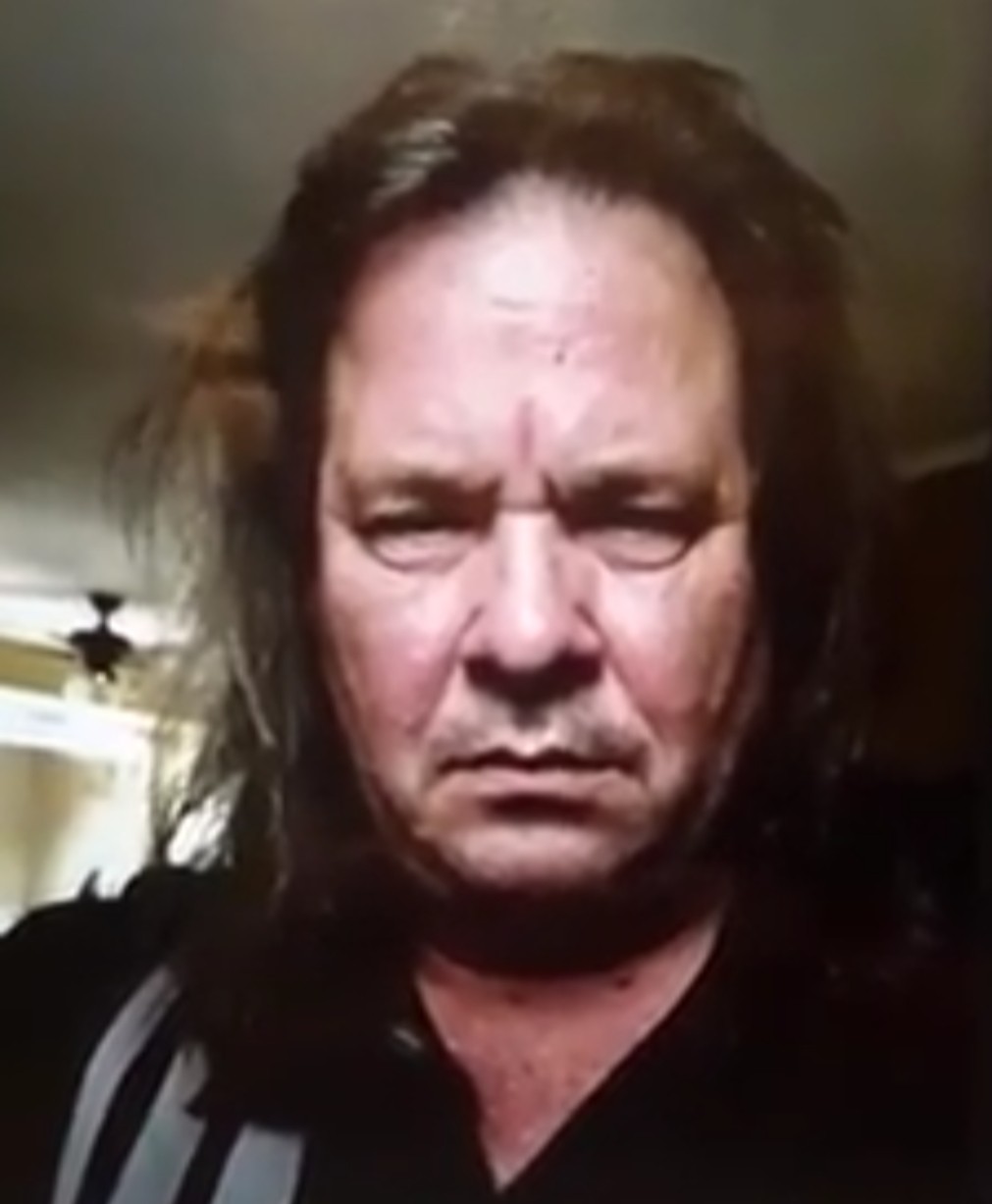 Close-up selfie-style photo of Thomas Schoenberger with long hair